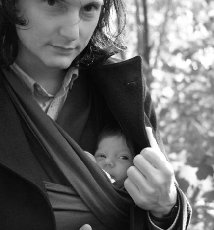 Cozy with a baby sling on a cold Swedish summer